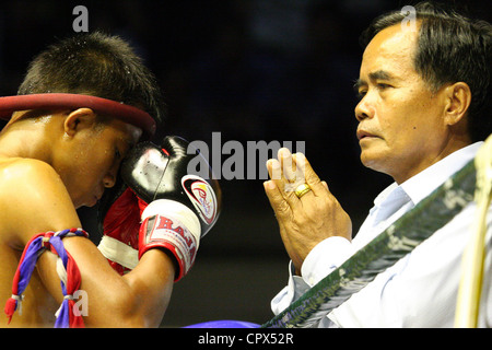 A boxer in preparation for a fight at the Rajadamern Muay Thai Stadium in Bangkok, Thailand. Stock Photo