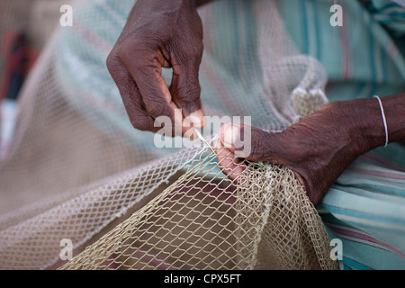 fishermen mending their nets at Kalpitiya, Sri Lanka Stock Photo