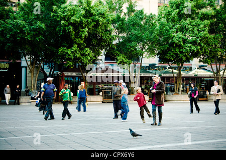 People walking in Nelson Mandela Square, Sandton, South Africa Stock Photo