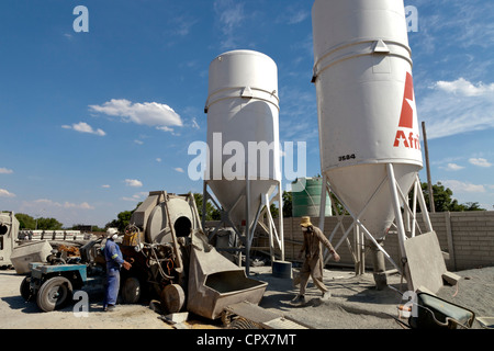 Overall shot of African workers working in construction yard Stock Photo