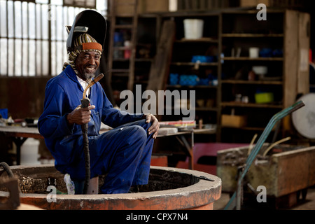 Welder smiling in a magnet factory, Gauteng, South Africa Stock Photo