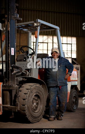 Fork lift operator in magnet factory, Gauteng, South Africa Stock Photo