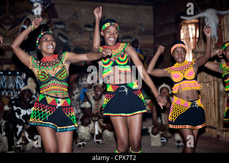 Three female African traditional dancers dancing Stock Photo