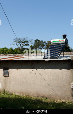 Residential home with solar power panels on the roof Stock Photo