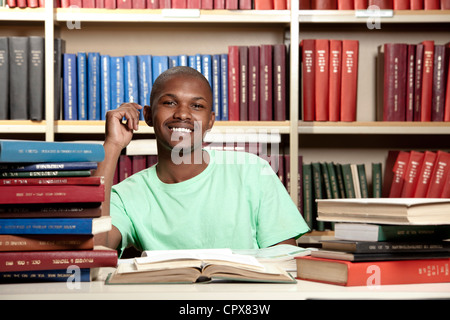Male student studying and smiling at camera Stock Photo