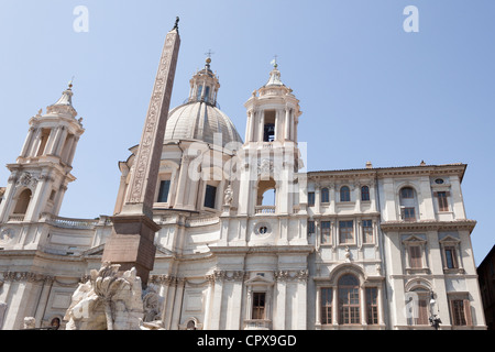 The 'Obelisk of Domitian' standing before the church of 'Sant'Agnese in Agone' a Baroque church in Piazza Navona, Rome, Italy. Stock Photo