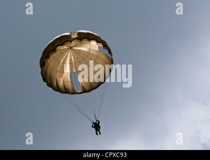 Task Force 68, which is made up of paratroopers from U.S., Germany, France, Holland, and United Kingdom, re-enacted the D-Day airborne operation on the La Fiere fields near Ste. Mere Eglise, France to commemorate the heroic acts of the WWII paratroopers who made the jump 68 years ago. After the jump, the task force marched into the town of Ste. Mere Eglise tothe sounds of cheers from the locals. Task Force 68 is in Normandy, France to commemorate the 68th annivesary of D-Day. Stock Photo