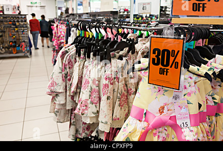 Clothes on sale in shop with 30 per cent off ticket, UK Stock Photo