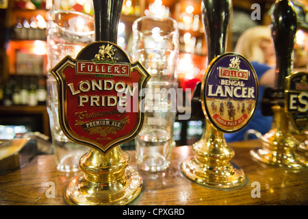 A real ale hand pump on the bar of the Euston Flyer, Kings Cross, London, UK. Stock Photo