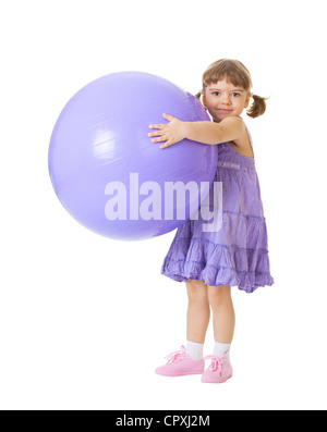 Little girl with a big purple ball isolated on white background Stock Photo
