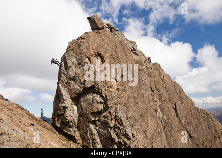 Climbers abseiling from the summit of the Inaccessible Pinnacle onto Sgurr Dearg in the Cuillin mountains, Stock Photo