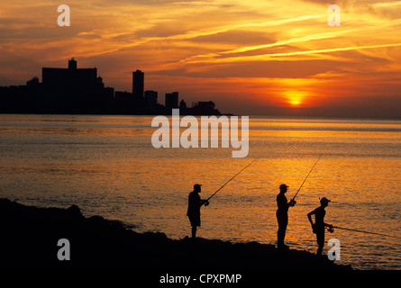 Cuba, Havana, sunset on the Malecon, fishermen Stock Photo