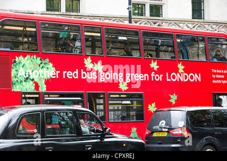 A hybrid electric diesel bus on the streets of London, UK. Stock Photo