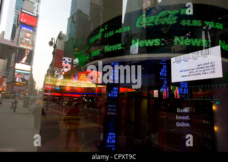 United States, New York City, Manhattan, Times Square, neon sign with stockmarket details on giant screen of a bank Stock Photo