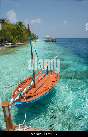 Dinghy at anchor on paradise island in Maldives Stock Photo