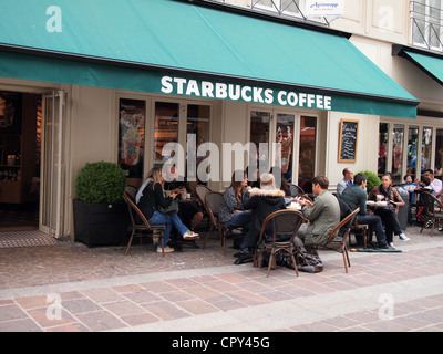 People enjoying Starbuck's coffee in Paris, France, May 10, 2012, © Katharine Andriotis Stock Photo