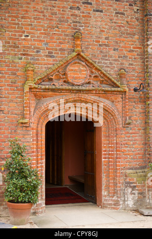 Brick entrance door of Eastbury Manor, Tudor mansion house in Barking, Essex, England, seen from the public highway Stock Photo