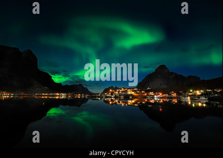 Norway, Nordland County, Lofoten Islands, Moskenes Island, aurora borealis over Reine fishermen village Stock Photo