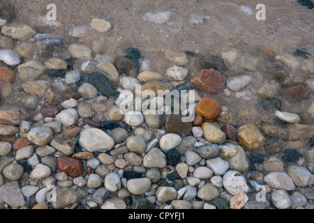Various eroded stones, agates, and pebbles on shore of Lake Huron Michigan USA Stock Photo