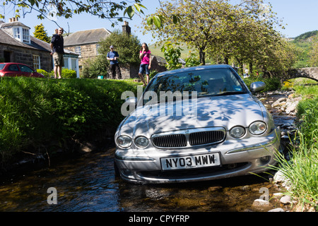 Jaguar X-type left the road in Dollar, Scotland, and drove into the river Dollar Burn on hot Sunday May 27th 2012. Stock Photo