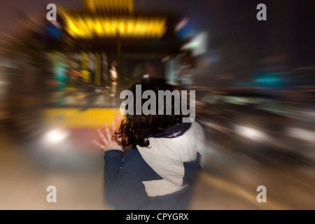 Concept of accident victim on the pedestrian crossing on road with bus in night Stock Photo