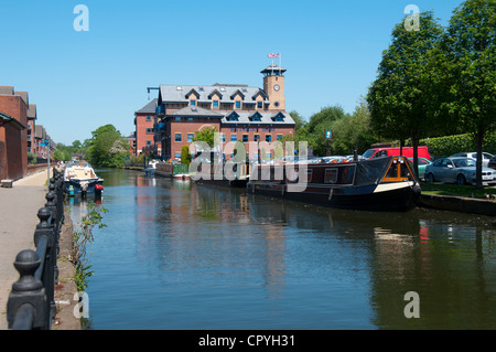 Narrowboats and apartments on the Bridgewater Canal at Sale Waterside, Cheshire, England, UK Stock Photo