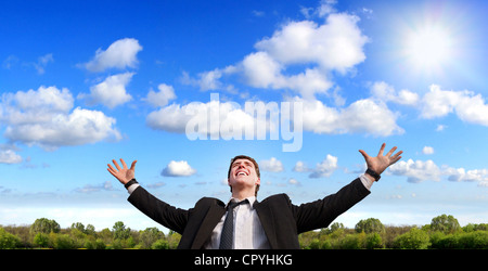 Happy young man and beautiful day alone on the meadow Stock Photo