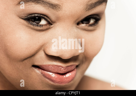 Closeup of young black woman smiling at camera Stock Photo