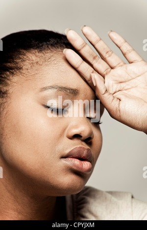Young nude black woman portrait looking down in black and white Stock