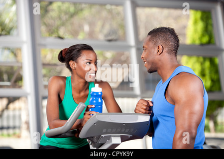 Two young black friends in a gym, chatting Stock Photo