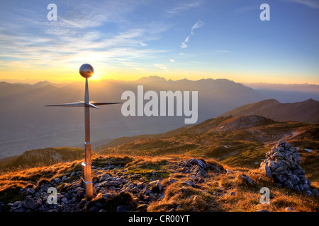 Summit cross of Mt Margelkopf above the Rhine Valley at dawn in autumn, Swiss Alps, Switzerland, Europe Stock Photo