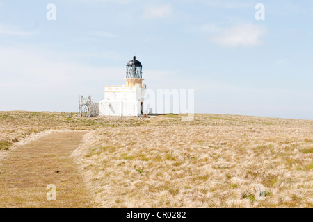 The brough of Birsay on the Orkney and lighthouse Stock Photo