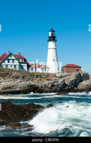 Lighthouse, waves breaking on rocks, Portland Head Light, Cape Elizabeth, Portland, Maine, New England, USA, North America Stock Photo