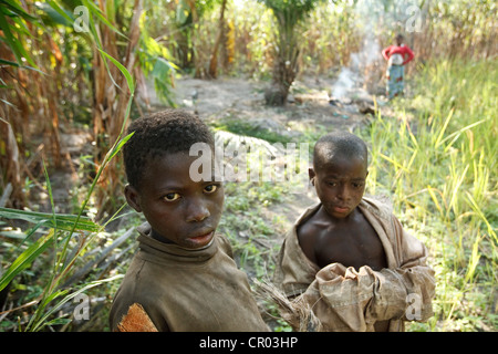 Boys who don't go to school stand in a field in Djorbana, Zanzan region, Cote d'Ivoire Stock Photo