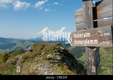 Wooden sign showing the hiking trail to Huberalm, Kitzbuehel Alps, Saalbach-Hinterglemm, Salzburg, Austria, Europe Stock Photo