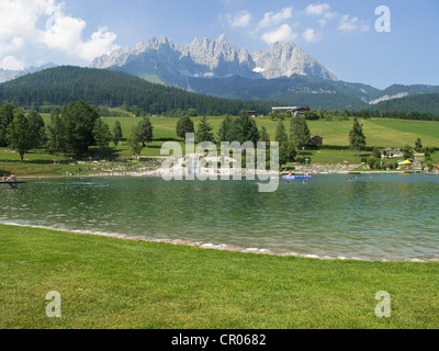 Bathing lake in Going, the Wilder Kaiser massif at back, Tyrol, Austria, Europe Stock Photo