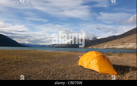 Man spin fishing, fighting a fish, Kusawa Lake, mountains behind, Indian  summer, leaves in fall colours, autumn, Yukon Territory Stock Photo - Alamy