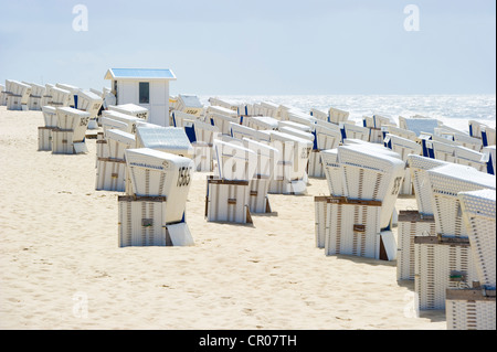 Roofed wicker beach chairs on the beach in Westerland, Sylt island, Schleswig-Holstein, Germany, Europe Stock Photo