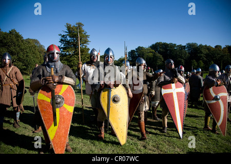 UK. England. Reenactment of 1066 Battle of Hastings. East Sussex. Men in chainmail with shields. Stock Photo