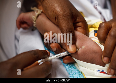 A child receives BCG vaccine during a routine vaccination session at the Henriette Konan Bedie Community hospital Stock Photo