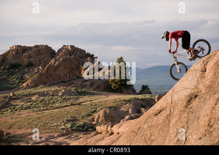 Mountain biker on rock formations Stock Photo