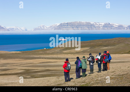 Tourists hike on the island, Diabasodden, Spitsbergen, Norway Stock Photo