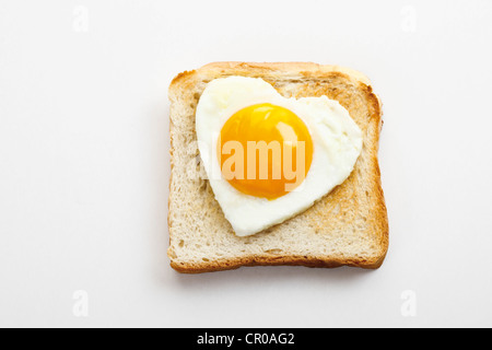 Toast with heart-shaped fried egg Stock Photo