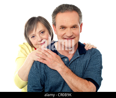 Attractive senior couple being playful over white background Stock Photo