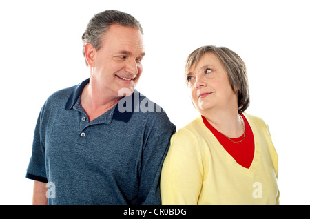 Attractive senior couple being playful. Posing back to back Stock Photo
