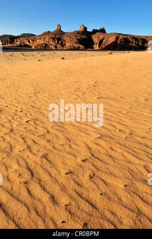 Sandstone rock formation and dunes on Tasset Plateau, Tassili n'Ajjer National Park, Unesco World Heritage Site, Wilaya Illizi Stock Photo