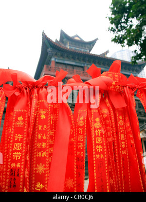 Wish making ribbons (qi yuan dai) hung in a Buddhist temple in Chongqing. Stock Photo