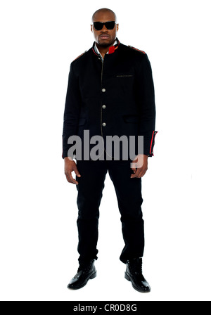 Fashionable african male dressed in black attire against isolated white background Stock Photo