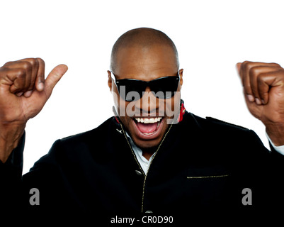 Excited young african man shouting in excitement with arms up. Closeup Stock Photo