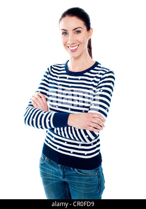 Beautiful lady in casuals posing with crossed arms Stock Photo